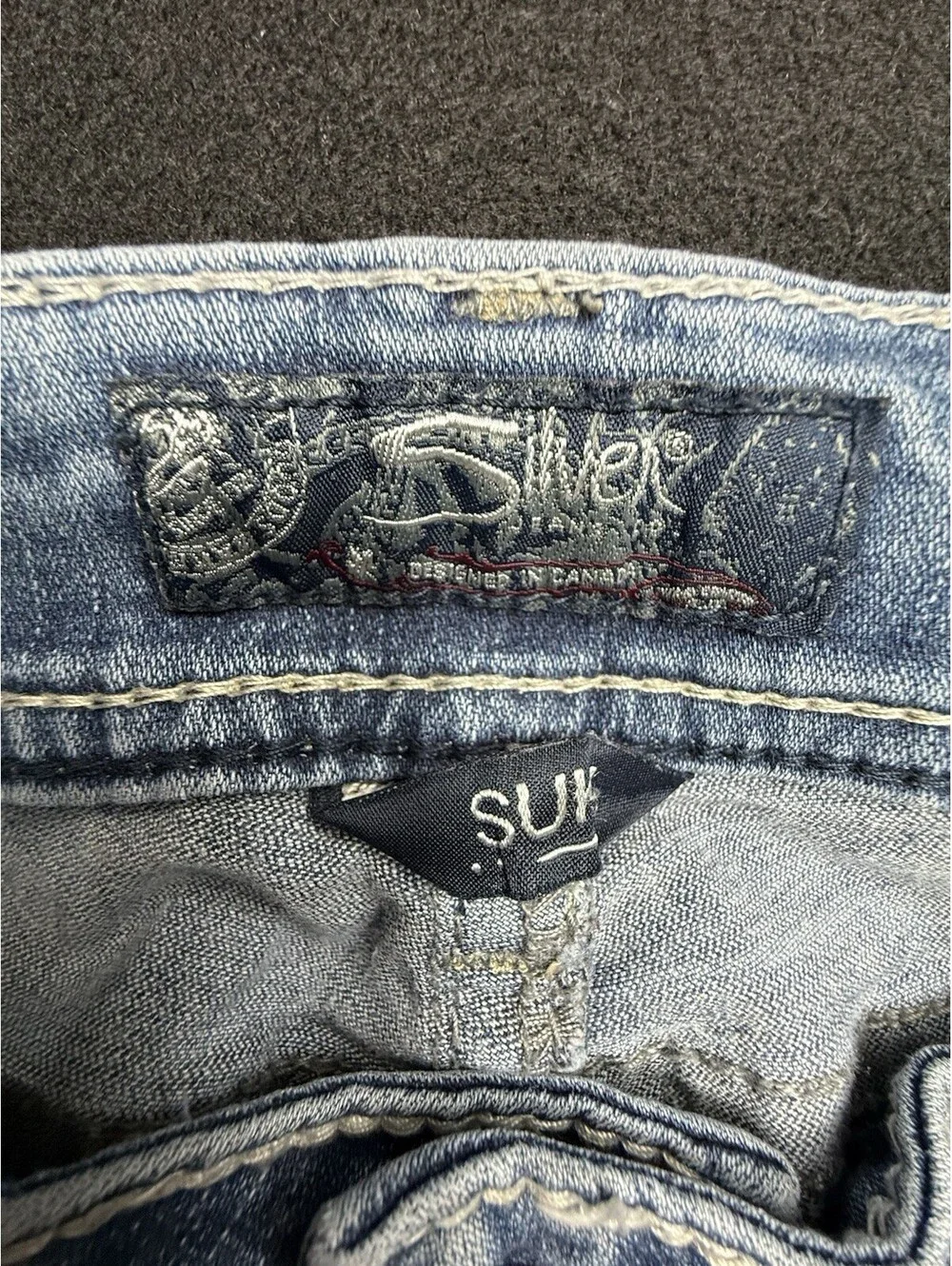 Silver Jeans Co. Men’s Suki Blue Light Wash Slim Bootcut Jeans Distressed